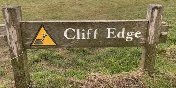 Photo of a sign saying cliff edge