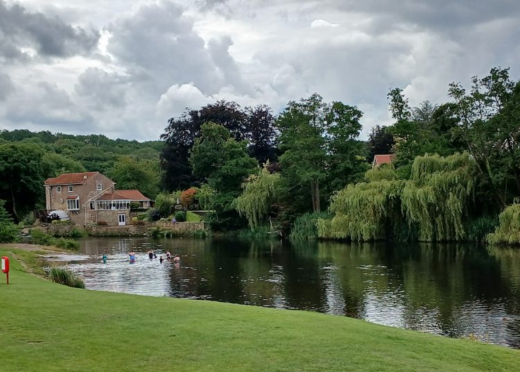 Image of people bathing in the River Nidd