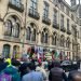 Children and adults demonstrating in front of Bradford town hall