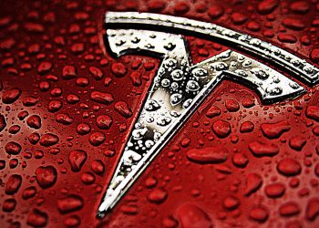 Tesla logo on red background