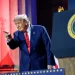President Trump on stage pointing at someone