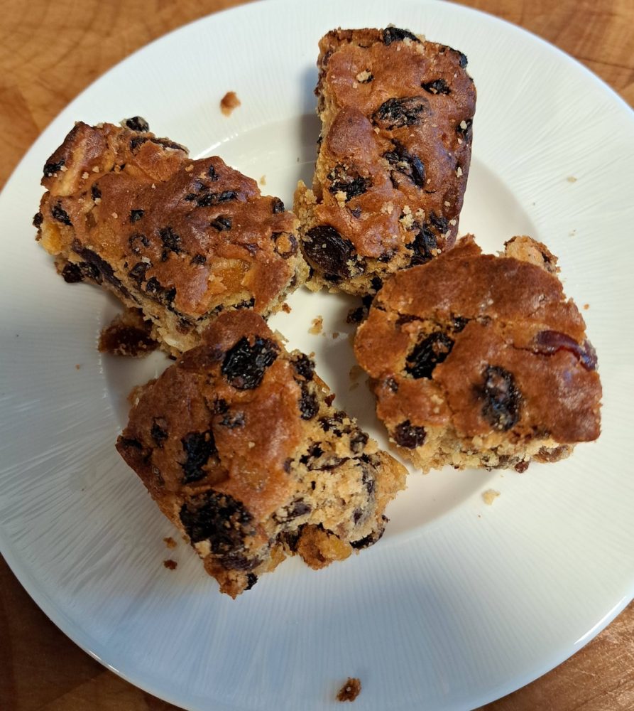 Slices of fruit cake on a white plate