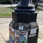 an old-fashioned streetlamp base with environment decorations around the base