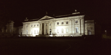a grand old building lit up at night
