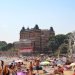 a busy beach in summertime