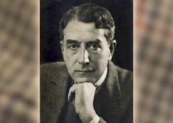an old black and white photo of a silent movie star against a blurry background